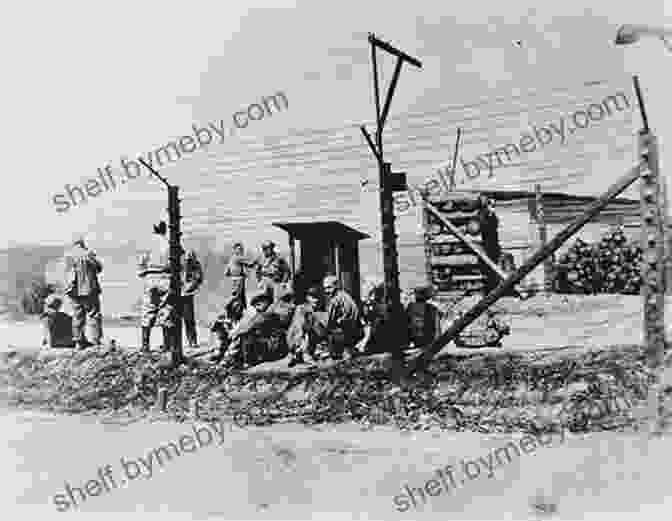 A Barbed Wire Fence Surrounds A Holocaust Concentration Camp, Symbolizing The Horrors Faced By Prisoners. The Holocaust: Never Forget Helen Strahinich