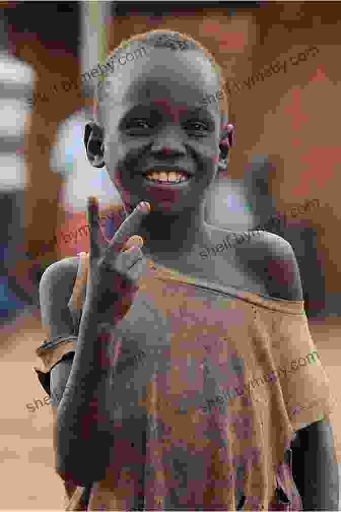 A Young Man Smiles Broadly, Surrounded By A Group Of Children In A Rural African Village. Jackson S Kenya: A Peace Corps Story