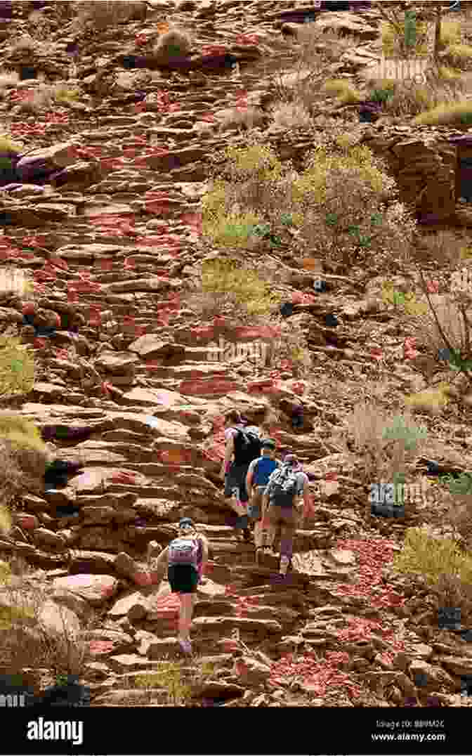 Hikers Ascend A Dry Canyon, Navigating Sandstone Formations. Canyoneering 2nd: A Guide To Techniques For Wet And Dry Canyons (How To Climb Series)